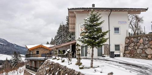 Fieberbrunn Apartment | Villa-Musica "Das Harmonikahaus" Apartments, Harmonikabau und Seminare