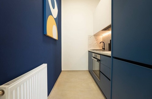 Funfhaus Apartment | Contemporary apartment with a balcony.