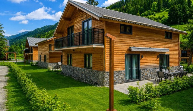 Chalet with mountain views by an Alpine lake
