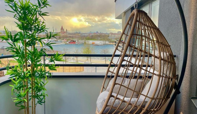 Riverfront Apartment with Balcony & AC